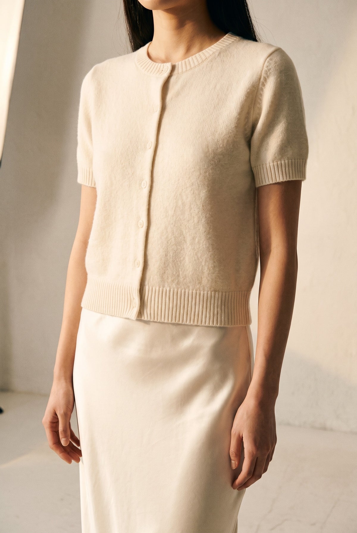 Crew Neck Short Sleeve Cardigan in whip cream — button placket detail