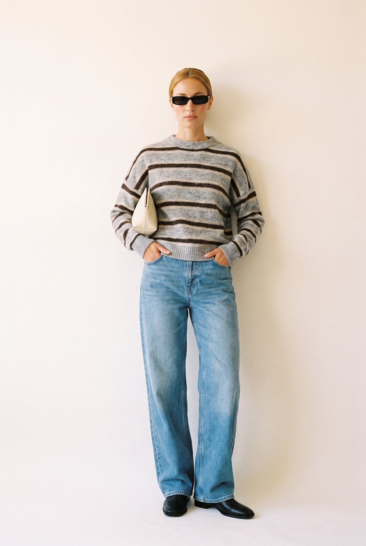 Sutton Striped Sweater in heather grey brown — full length with denim