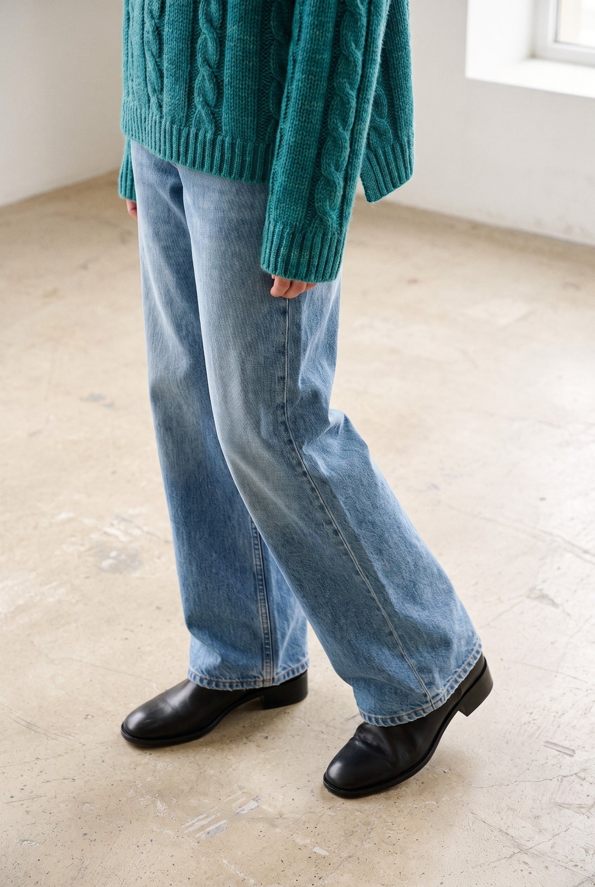 The Danica Sweater in green multi — hem and boots