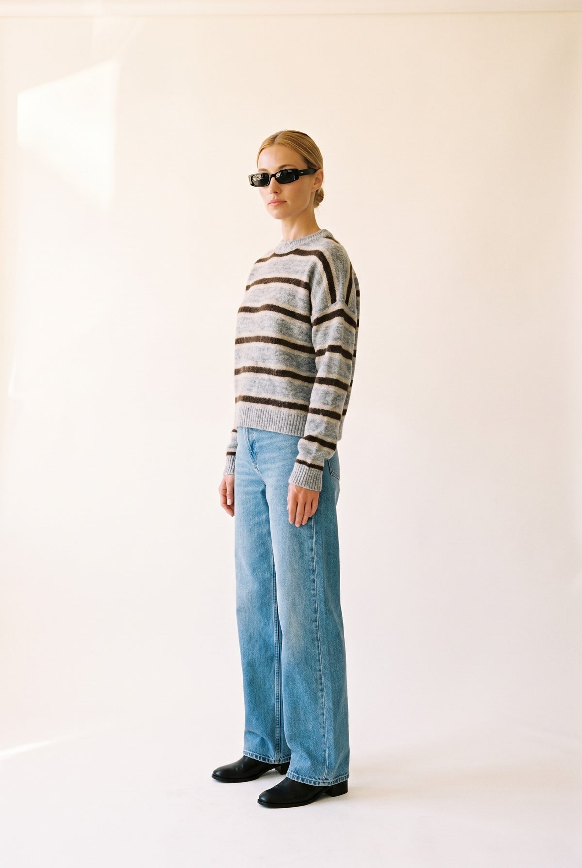 Sutton Striped Sweater in heather grey brown — side profile